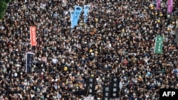 Estudiantes de la Universidad China de Hong Kong en una marcha el 2 de septiembre (Foto: Philip Fong/AFP).