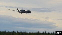 Un drone RQ-4 Global Hawk. (Tristan Viglianco/AFP).