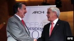 Los candidatos a la presidencia de Chile Sebastián Piñera (d) y Alejandro Guillier (i).