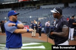 (i-e) Kendrys Morales y Aroldis Chapman.