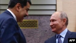 Vladimir Putin y Nicolás Maduro en una reunión en Novo-Ogaryovo en las afueras de Moscú el 5 de diciembre de 2018. (Archivo)